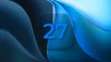 The number 27 over a fluid blue background representing the iOS 27 software update.