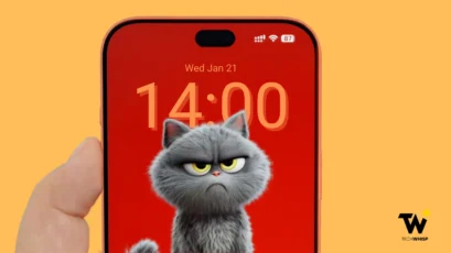 Front view concept render of the rumored iPhone 18 Pro Max held in hand, showing a slim bezel, Dynamic Island, and a custom lock screen featuring an angry grey cat graphic.